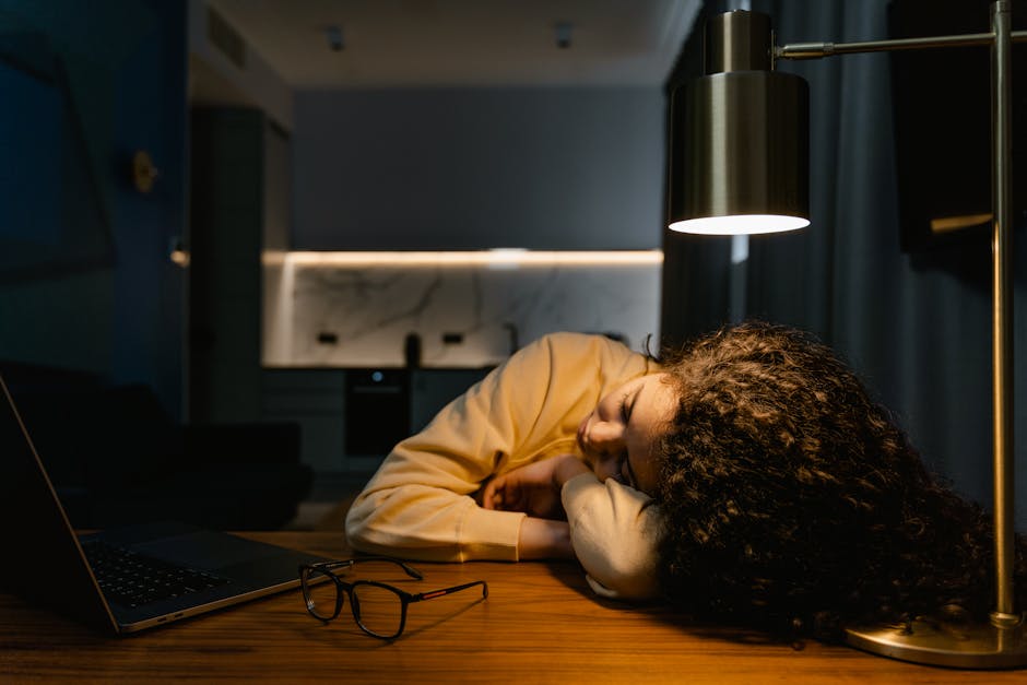 person looking at a computer screen with tired eyes