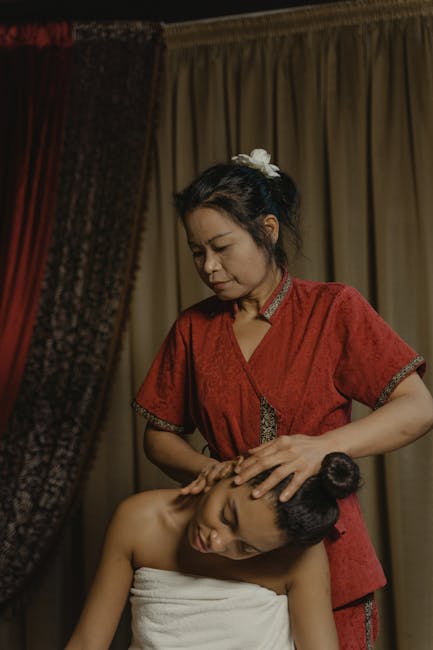 professional woman performing eye massage with care
